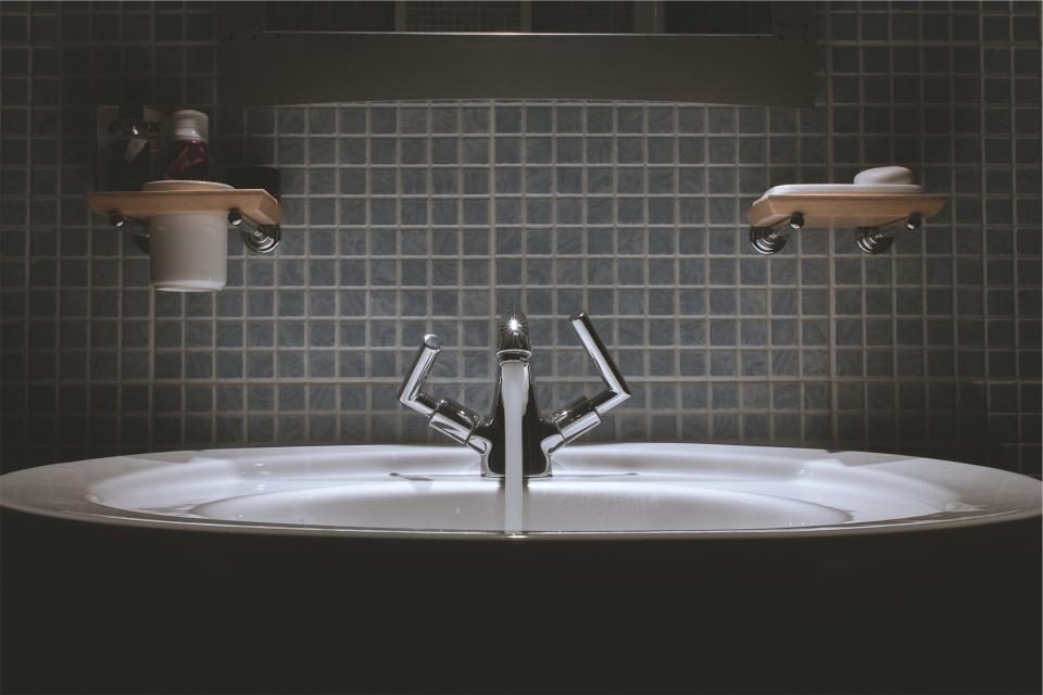 Wall-mount faucet over a bathroom sink in a Fort Lauderdale, FL home